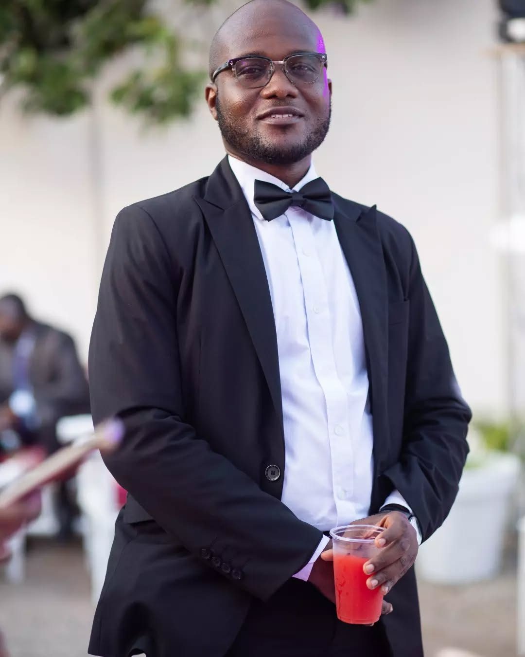 Stanley in a black tuxedo at a celebration